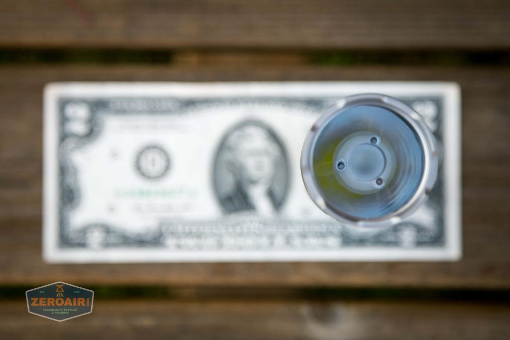 acebeam l17 osram white 18650 thrower on two dollar bill