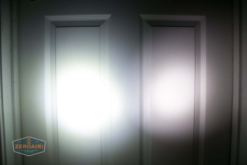 A white paneled door is illuminated by two overlapping circles of bright white light, casting distinct beams. A small ZeroAir! logo appears in the lower left corner.