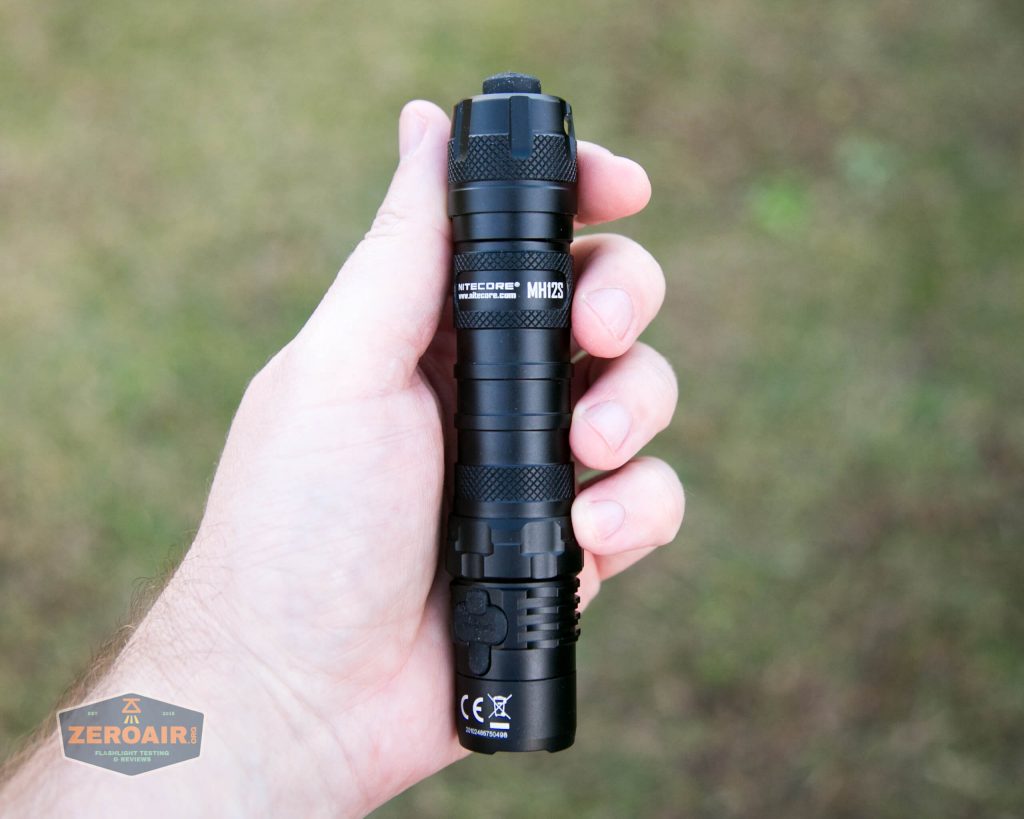 nitecore mh12s tactical flashlight in hand