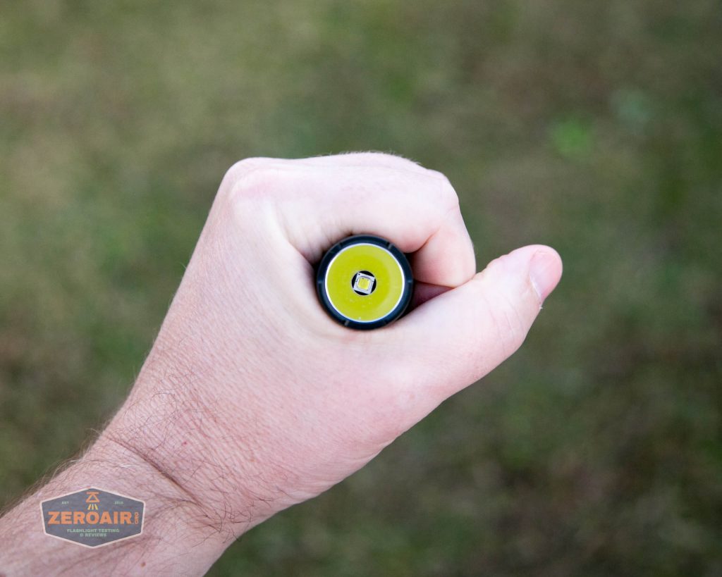 nitecore mh12s tactical flashlight in hand