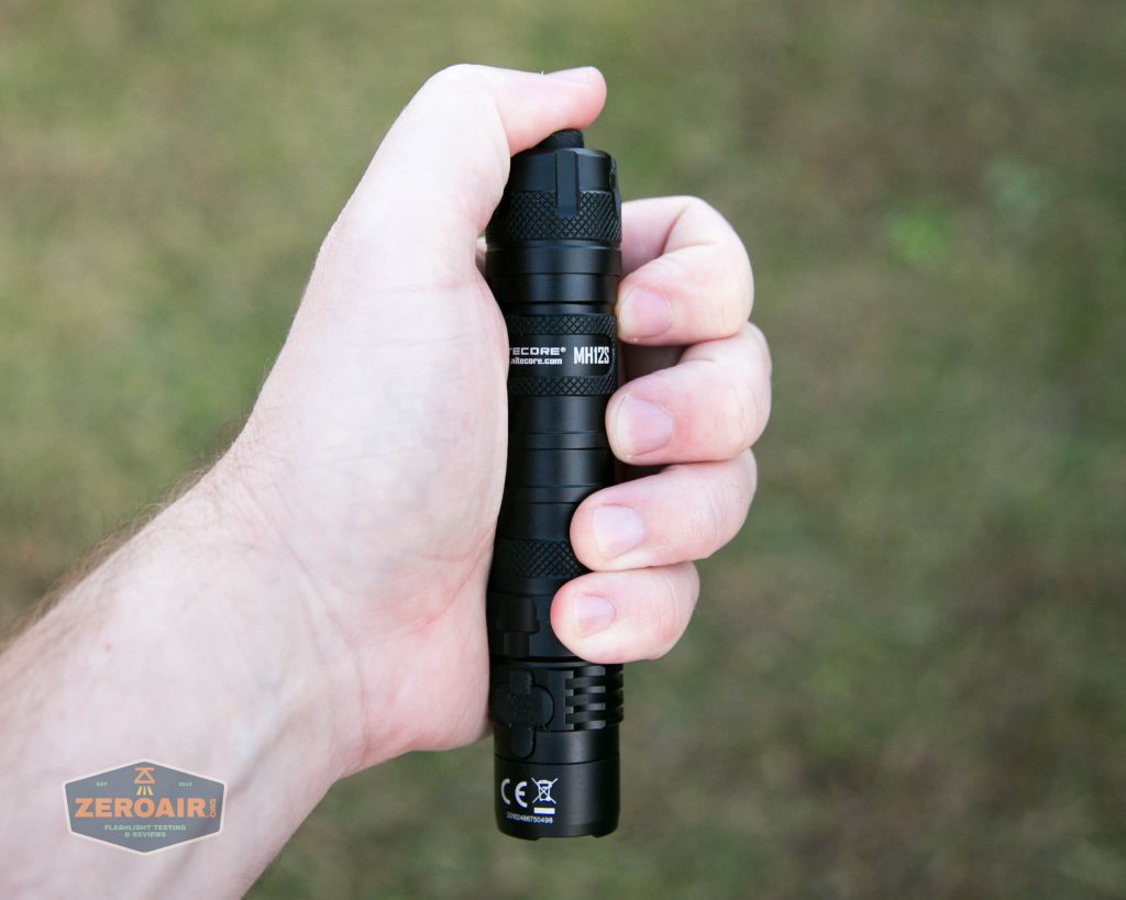nitecore mh12s tactical flashlight in hand