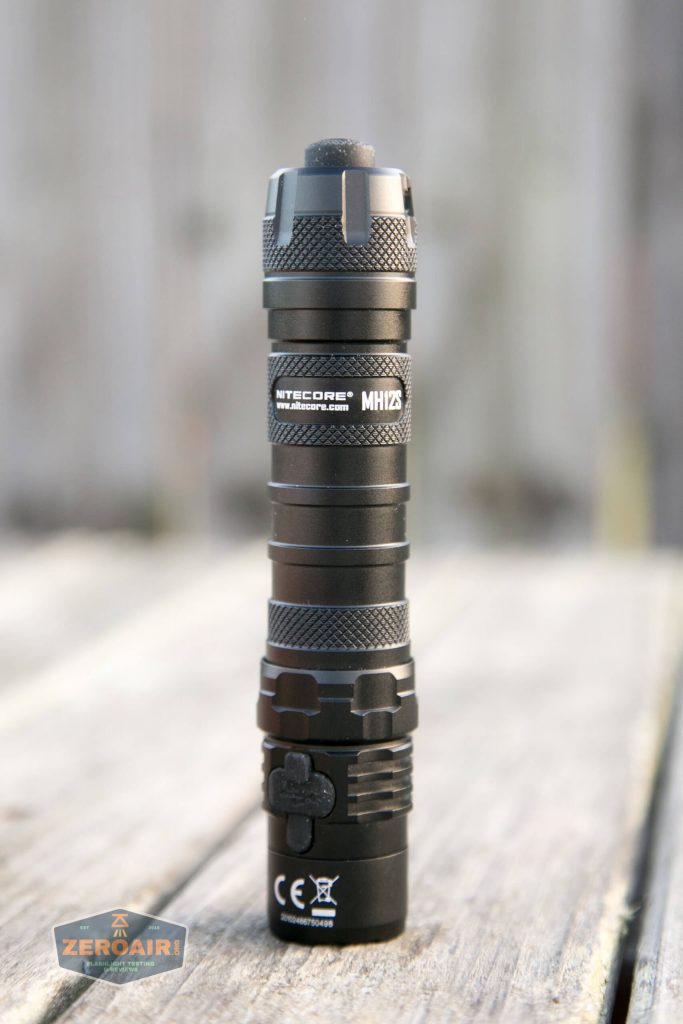 nitecore mh12s tactical flashlights group shot showing quarter