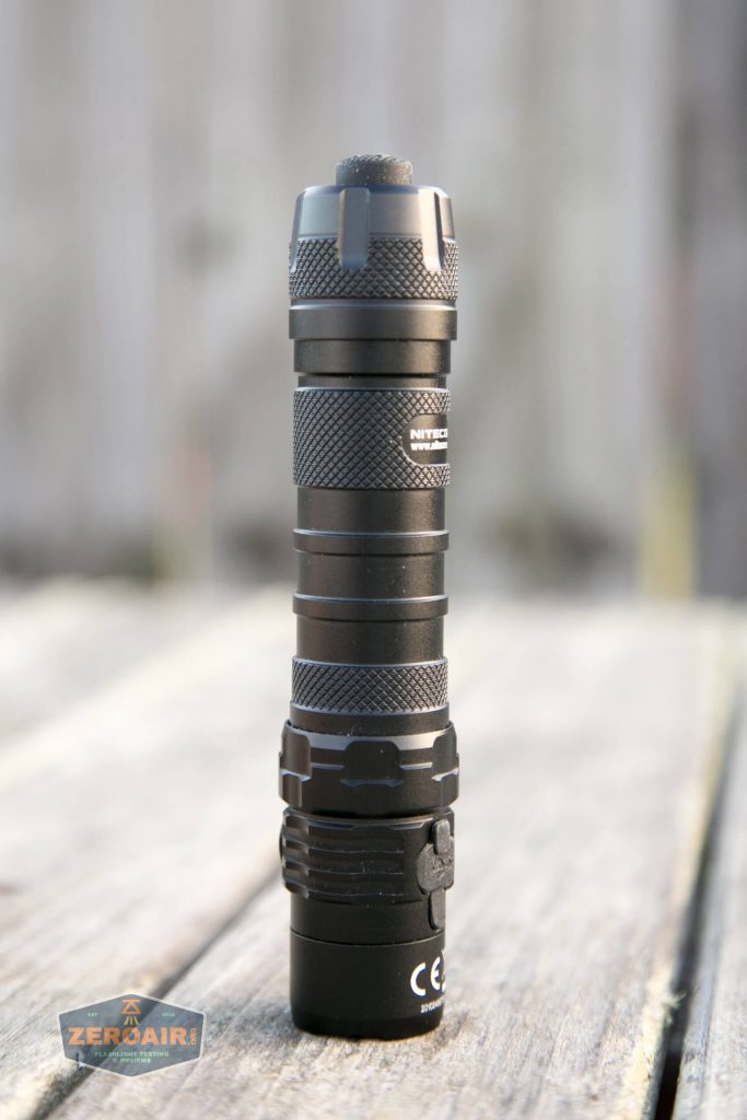 nitecore mh12s tactical flashlights group shot showing quarter