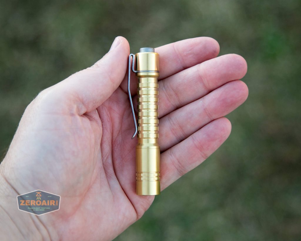reylight pineapple mini brass nichia 219b in hand