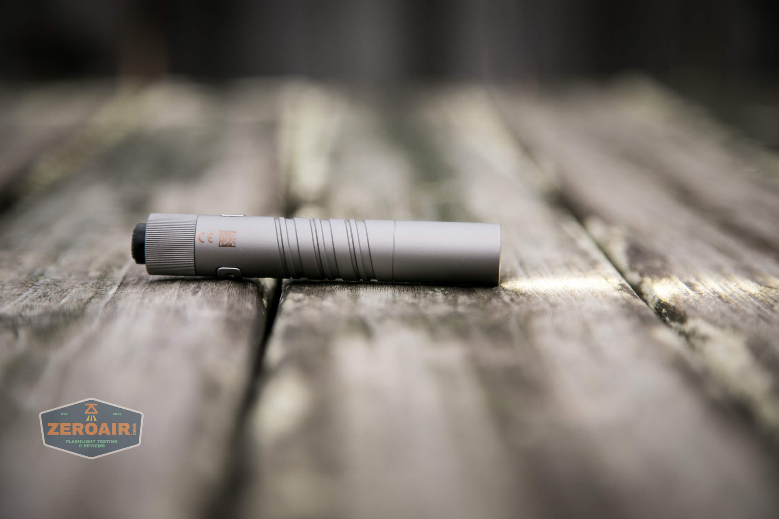 olight i3t eos titanium aaa flashlight on