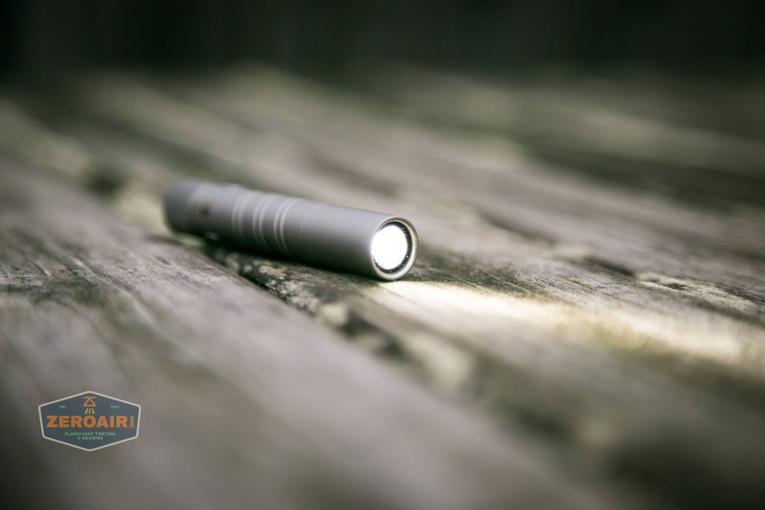 olight i3t eos titanium aaa flashlight on