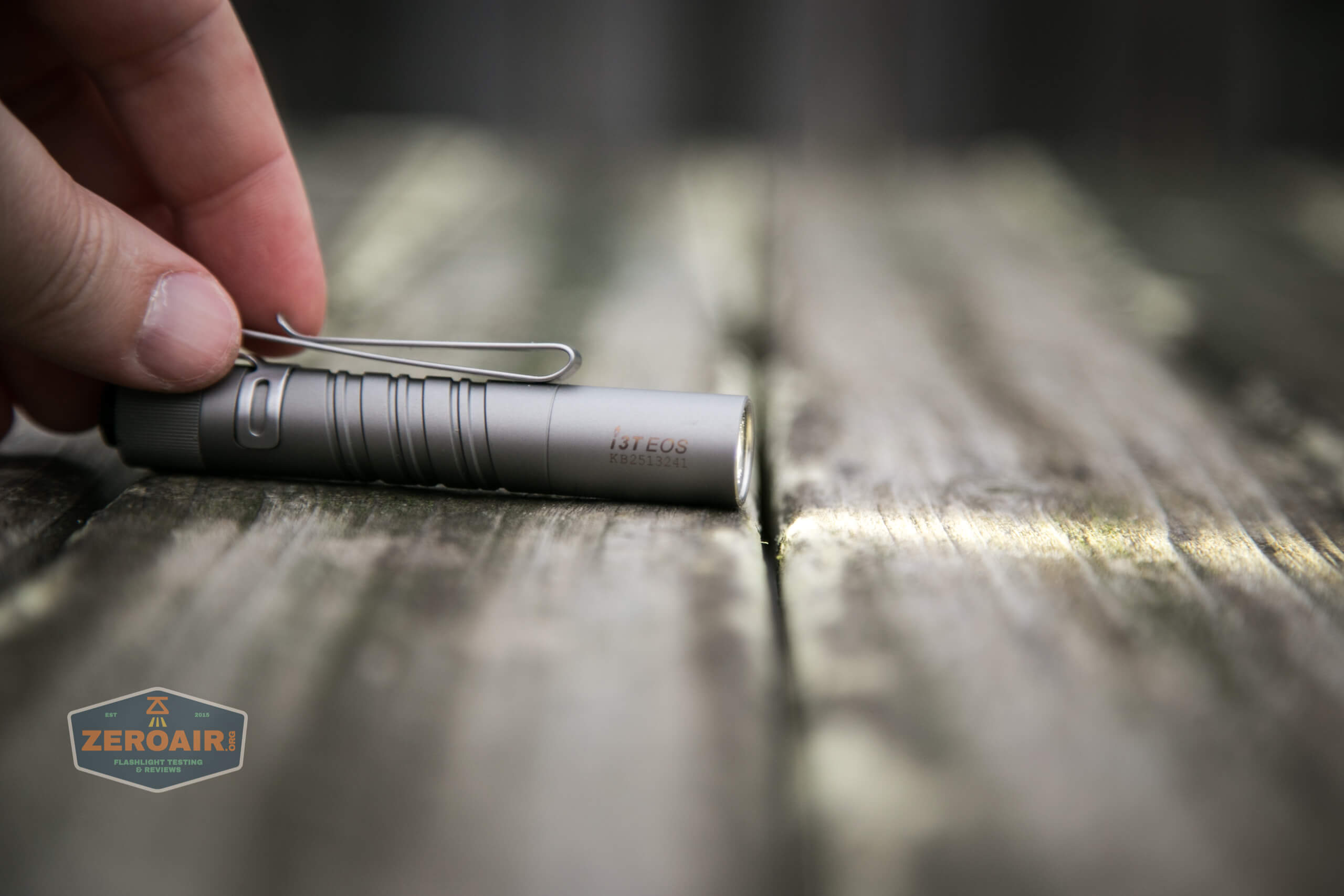 olight i3t eos titanium aaa flashlight on