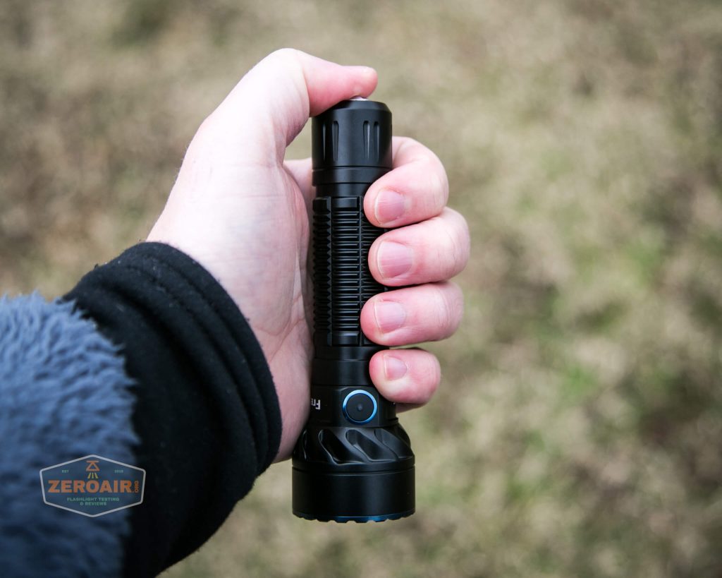 olight freyr rgb flashlight in hand