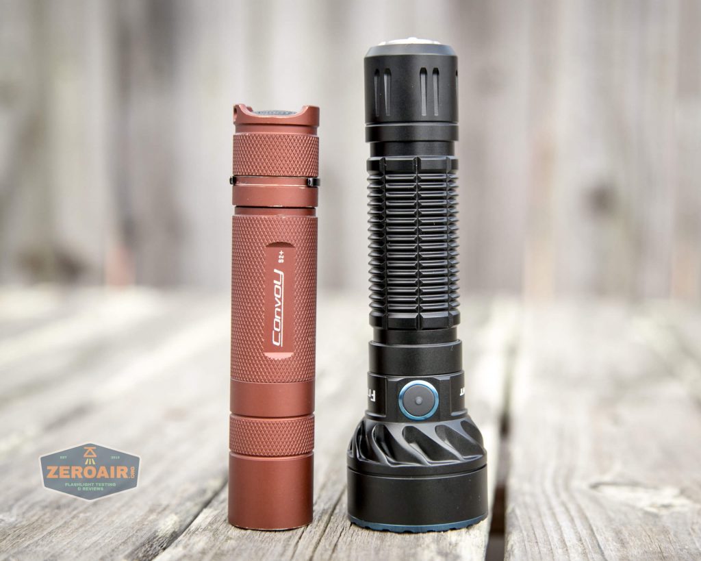 olight freyr rgb flashlight beside convoy s2+