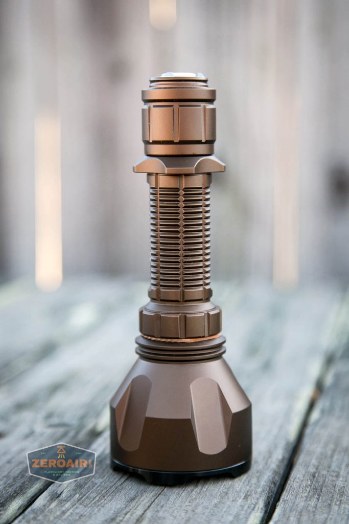 olight warrior x turbo desert tan flashlight feature photo standing