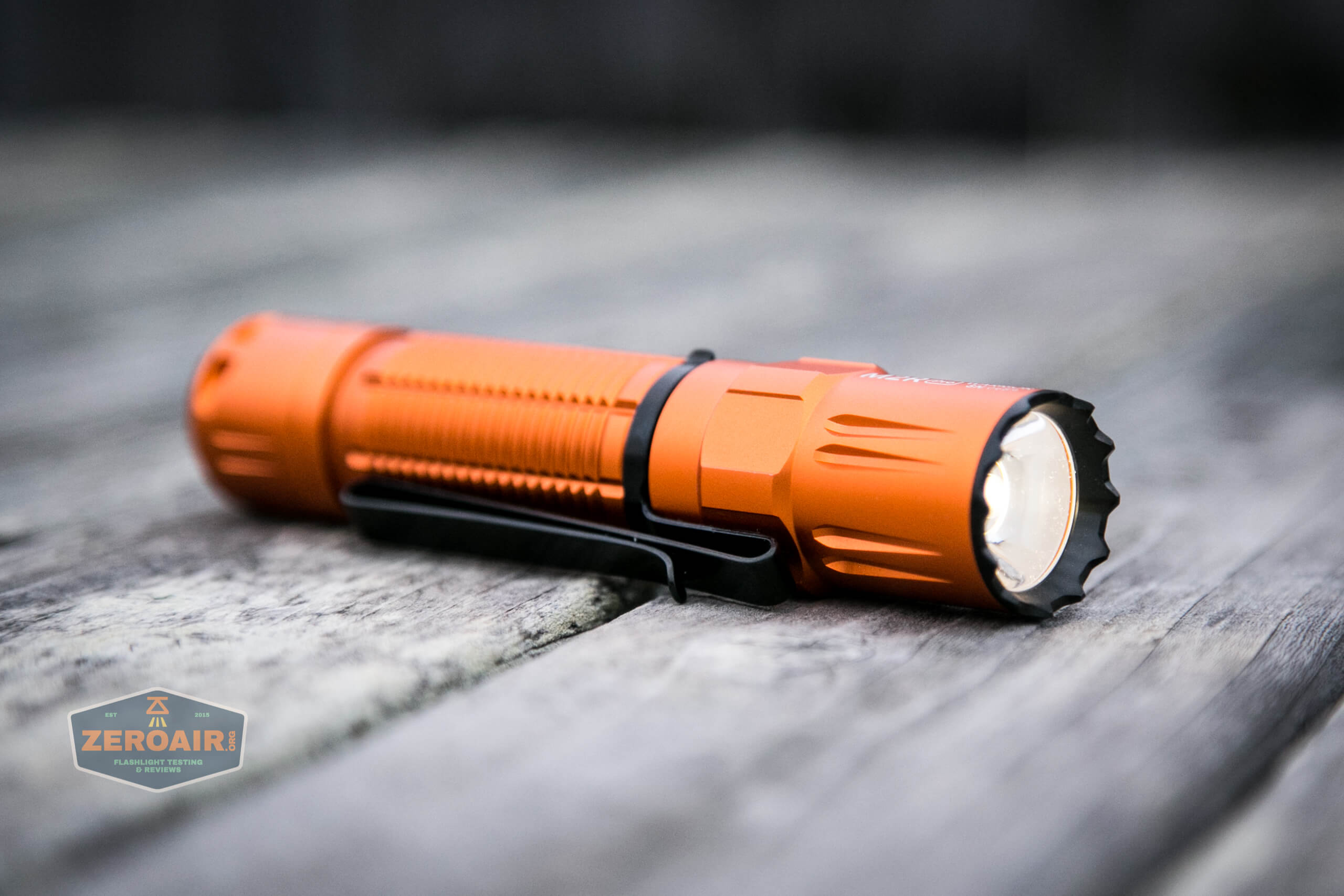 Olight M2R Pro Warrior Orange laying on side
