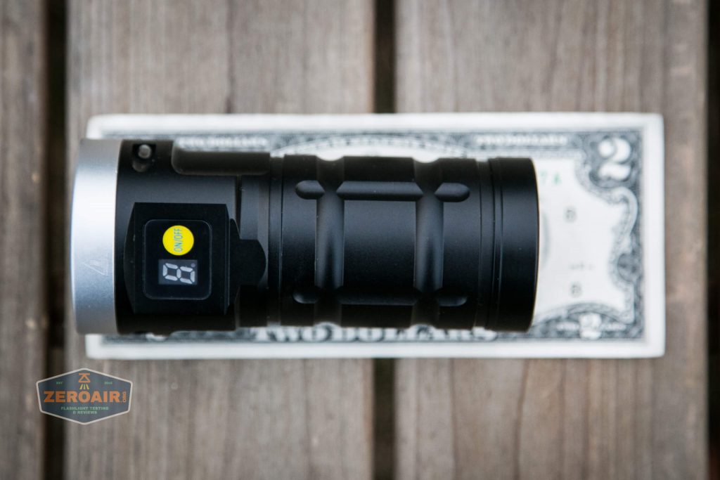 nitebeam x12uv flashlight on two dollar bill