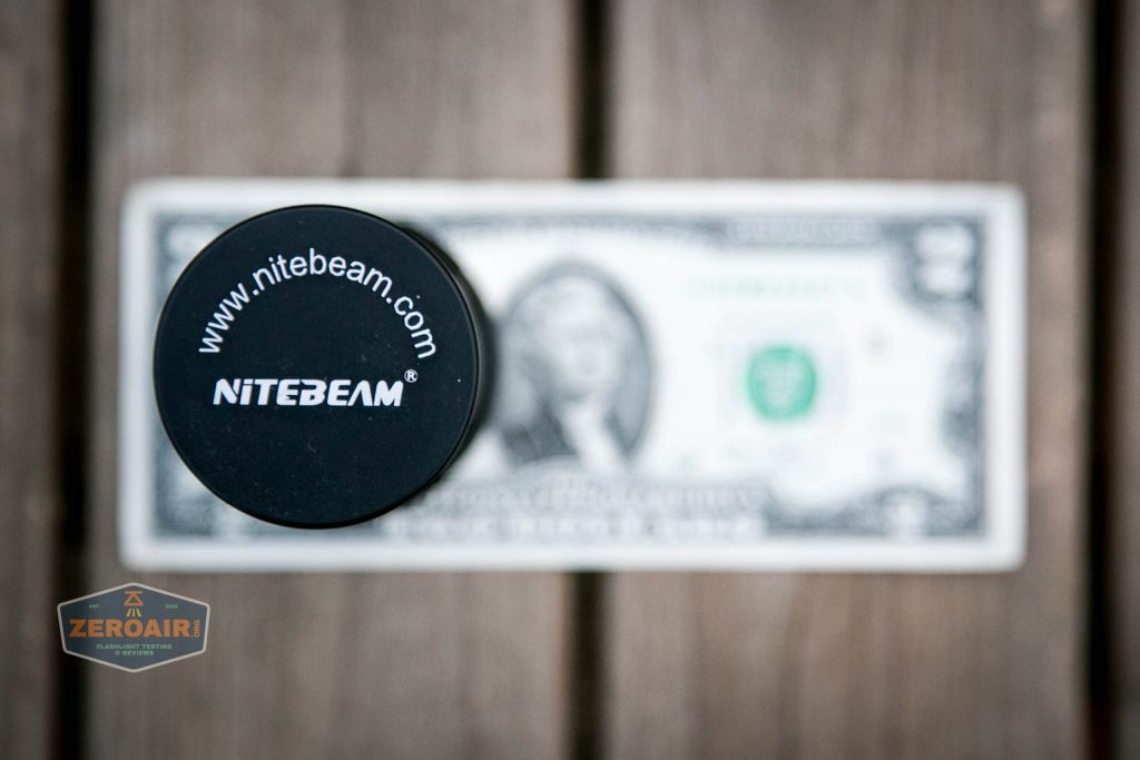 nitebeam x12uv flashlight on two dollar bill