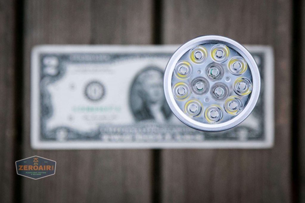 nitebeam x12uv flashlight on two dollar bill