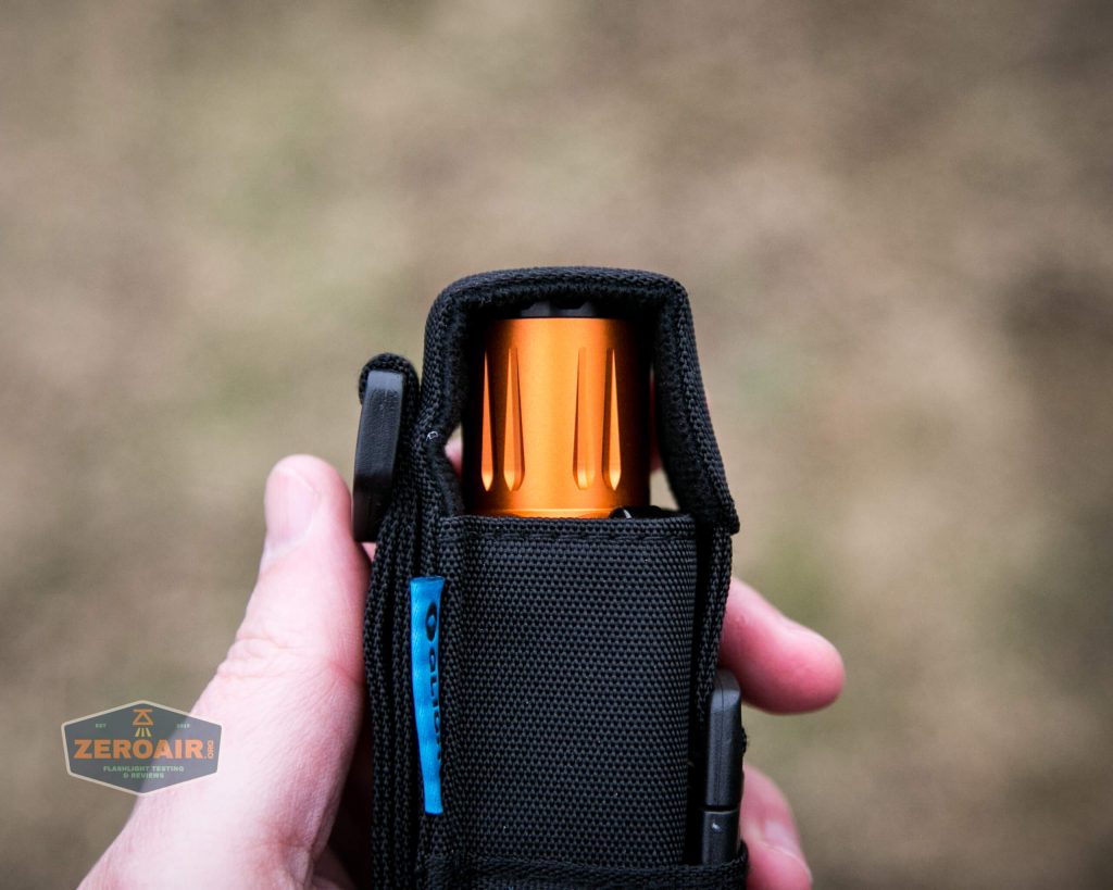 Olight M2R Pro Warrior Orange nylon pouch in hand bezel up