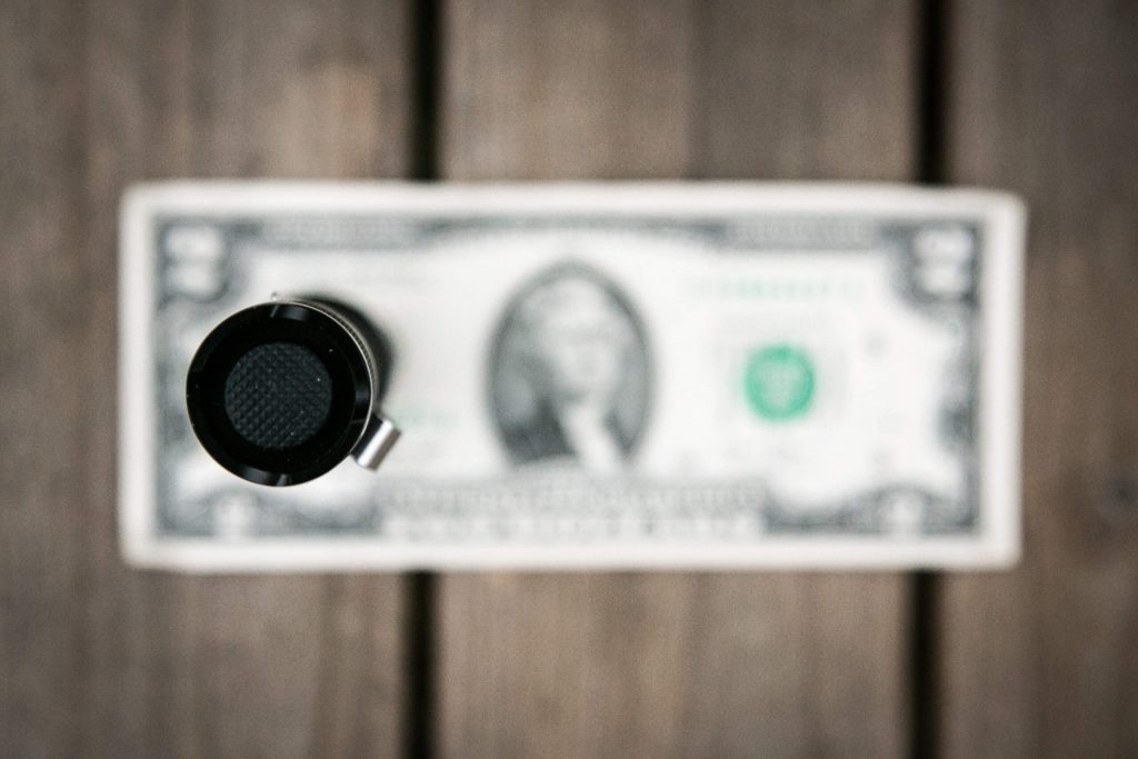 sofirn sp31uv ultraviolet 18650 flashlight on two dollar bill