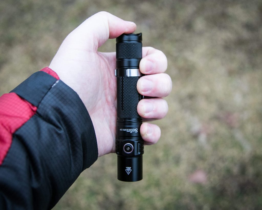 sofirn sp31uv ultraviolet 18650 flashlight in hand