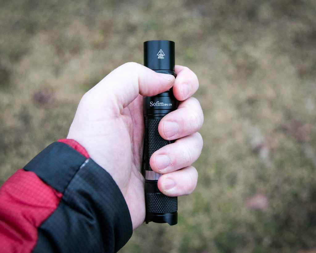 sofirn sp31uv ultraviolet 18650 flashlight in hand