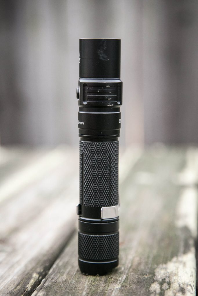 sofirn sp31uv ultraviolet 18650 flashlight feature photo standing