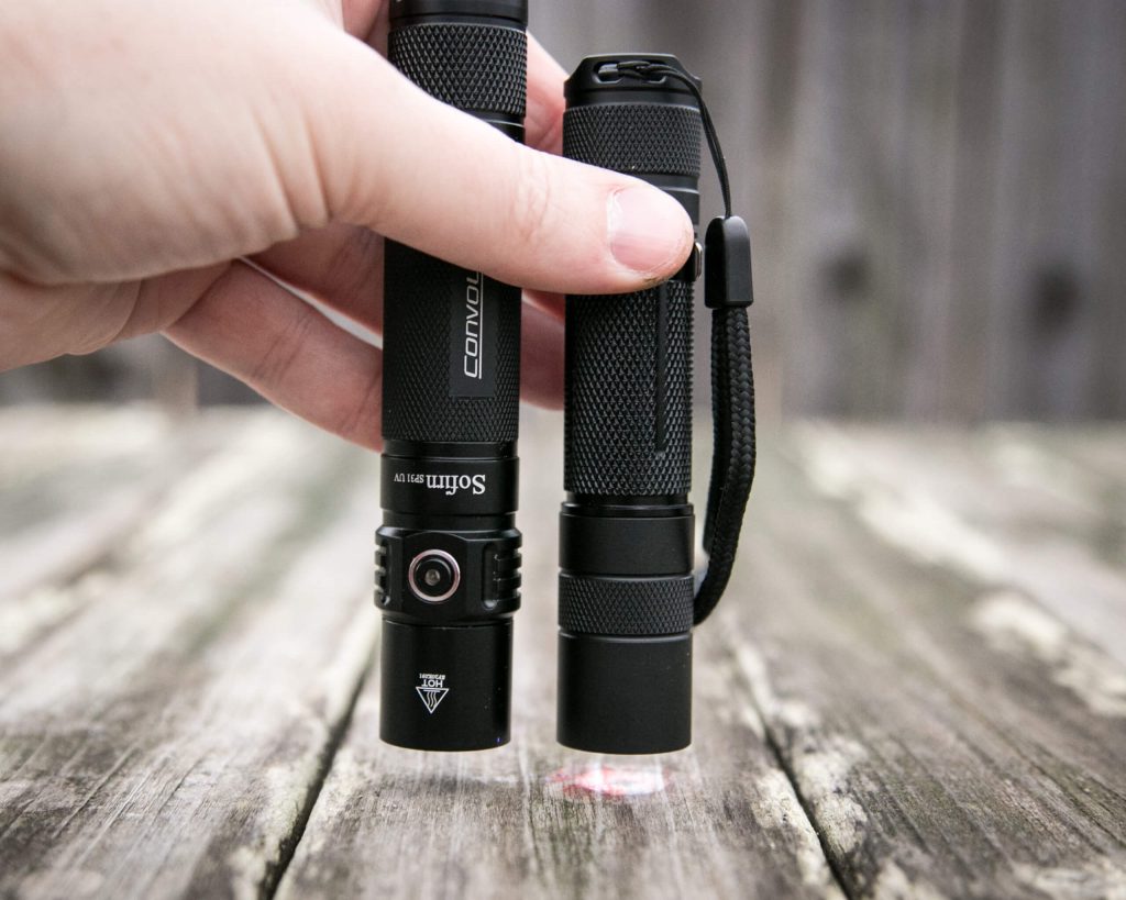 sofirn sp31uv ultraviolet 18650 flashlight beside convoy s2+ uv