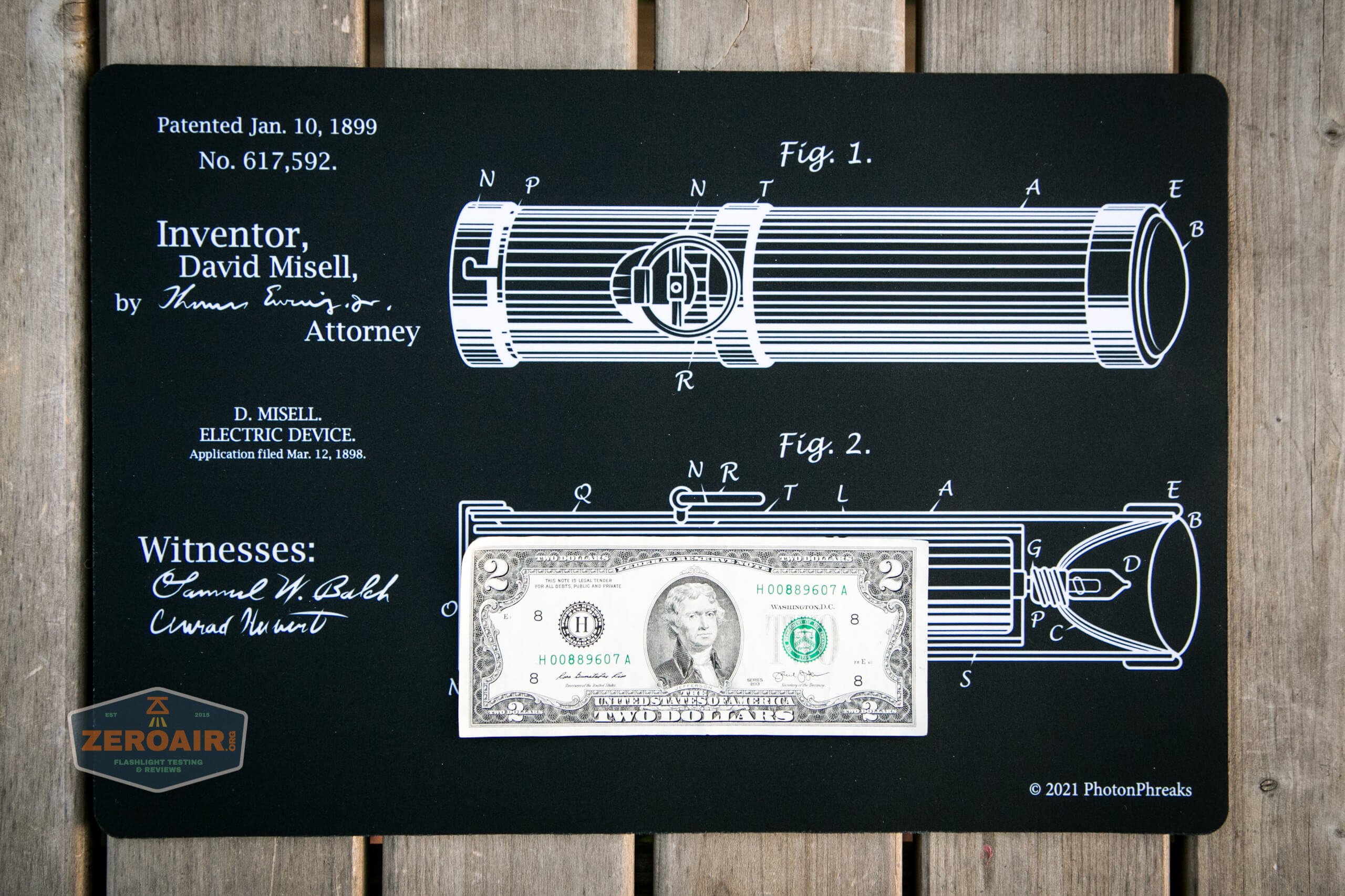 two-dollar bill on mat