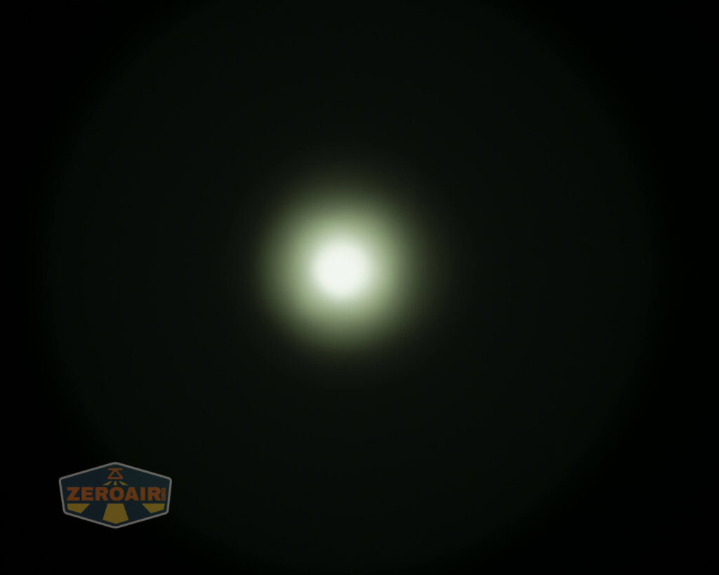 A bright white circle is centered on a black background, creating a glowing halo effect. The ZeroAir logo appears in the lower left corner.