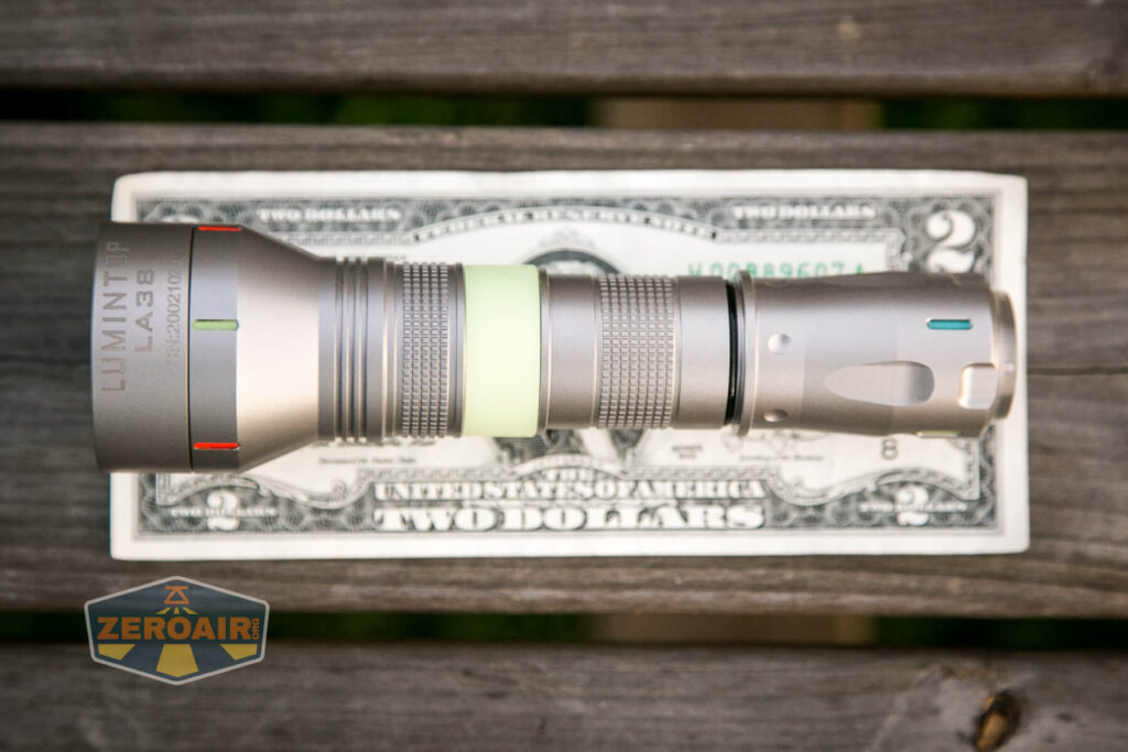 Lumintop LEP 18650 on two-dollar bill;