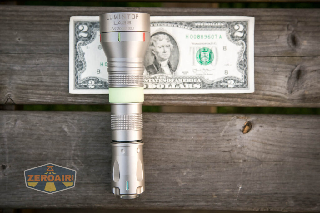 Lumintop LEP 18650 on two-dollar bill;