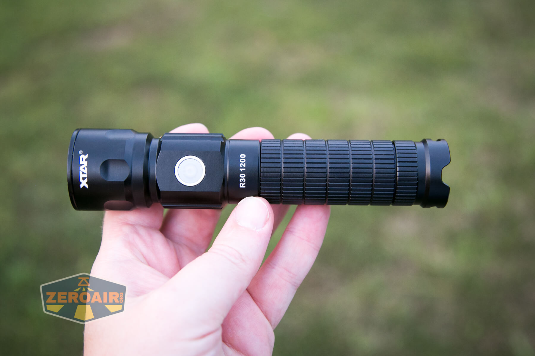 XTAR R30 1200 Flashlight in hand