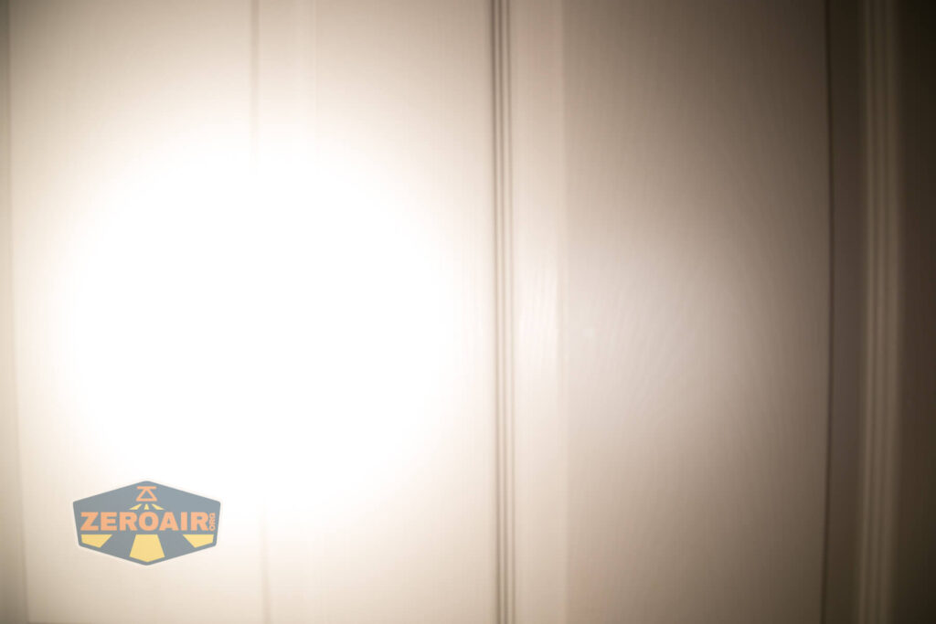 Lumintop FWAA TiCU 14500 flashlight beamshots on door compared to nichia 219b