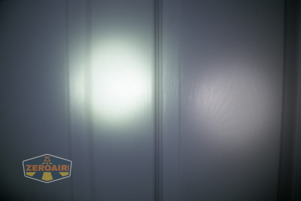 Nicron H15 Headlamp beamshots on door compared to nichia 219b