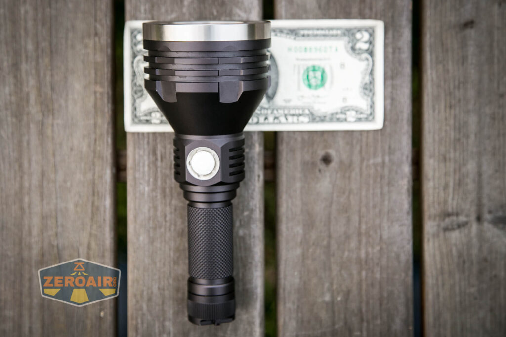 Noctigon K1 21700 Flashlight on two dollar bill