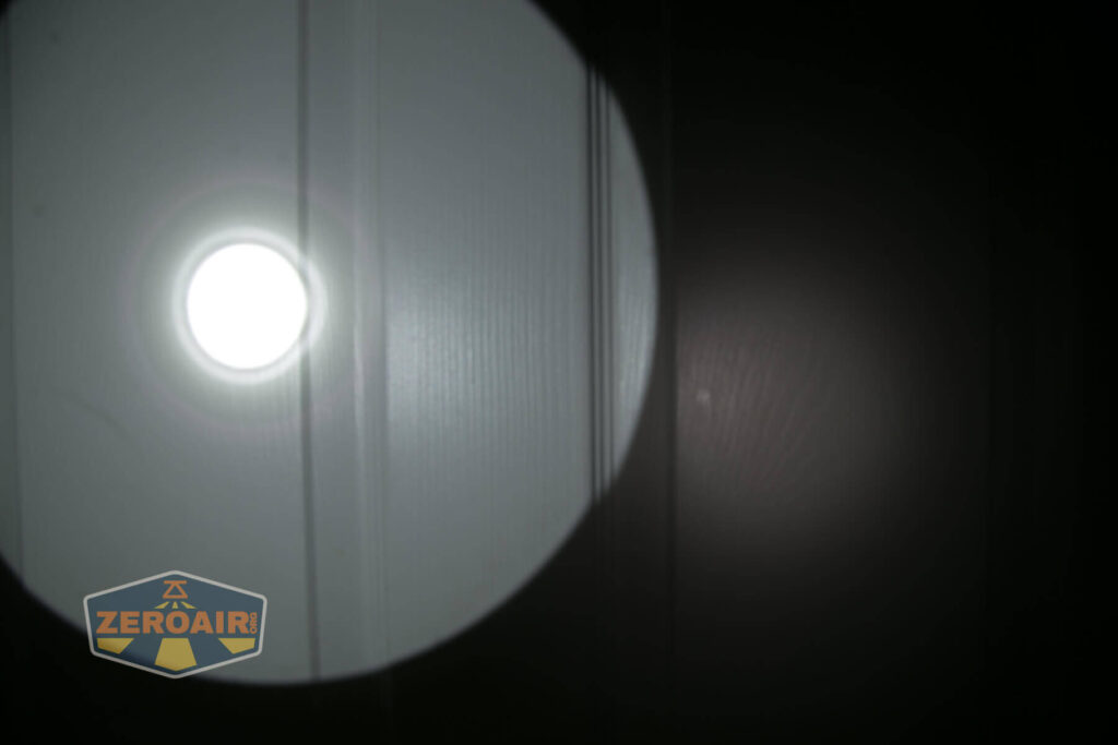 Noctigon K1 21700 Flashlight beamshot on door compared to nichia 219b