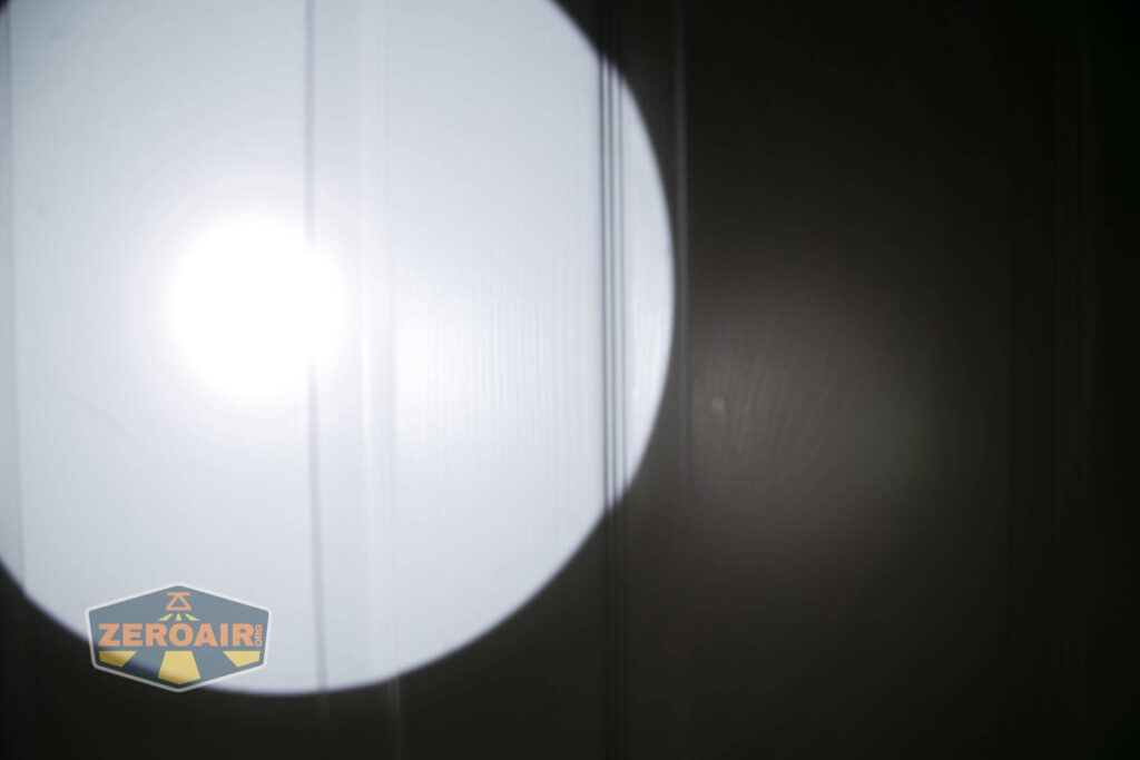 Noctigon K1 21700 Flashlight beamshot on door compared to nichia 219b