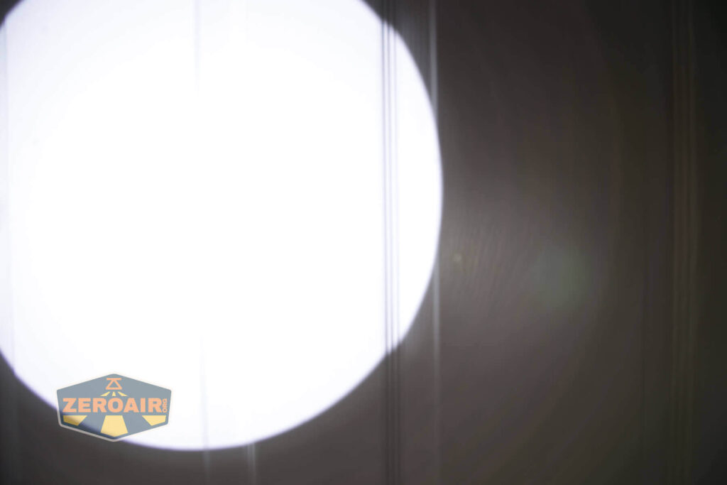 Noctigon K1 21700 Flashlight beamshot on door compared to nichia 219b