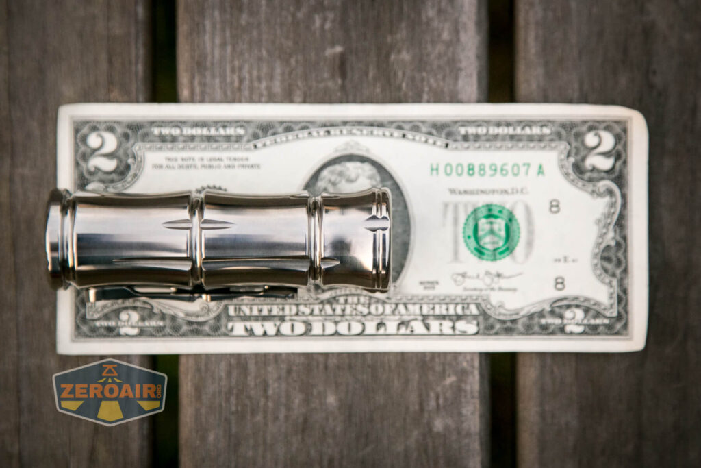 WWLZ Bamboo Small 18350 flashlight on two-dollar bill