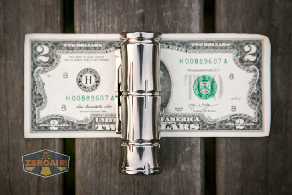 WWLZ Bamboo Small 18350 flashlight on two-dollar bill