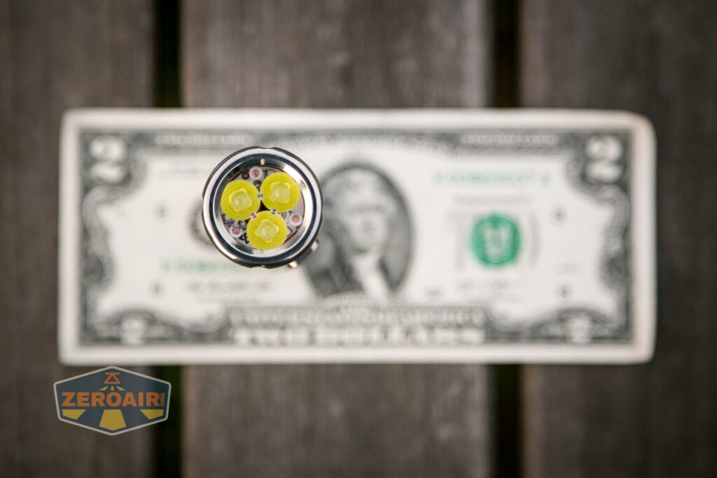 WWLZ Bamboo Small 18350 flashlight on two-dollar bill