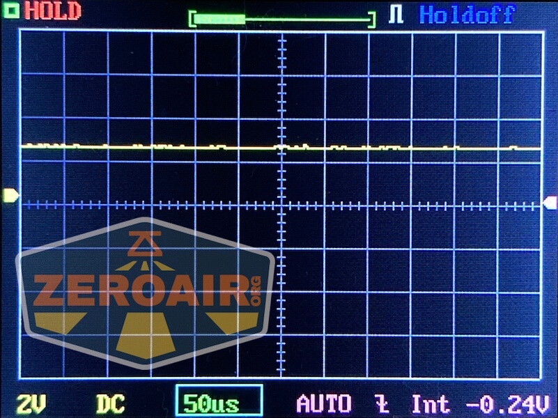 A digital oscilloscope displays a flat yellow signal line near zero on a grid, with settings showing 2V DC, 50 microseconds per division, and -0.24V. The ZeroAir logo is visible in the lower left beside a WWLZ Bamboo Small label.