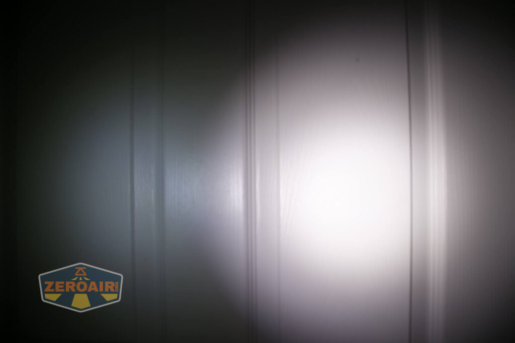 WWLZ Bamboo Small 18350 flashlight beamshots on door compared to nichia 219b white modes