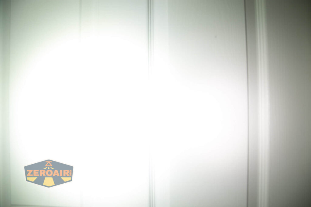 WWLZ Bamboo Small 18350 flashlight beamshots on door compared to nichia 219b white modes