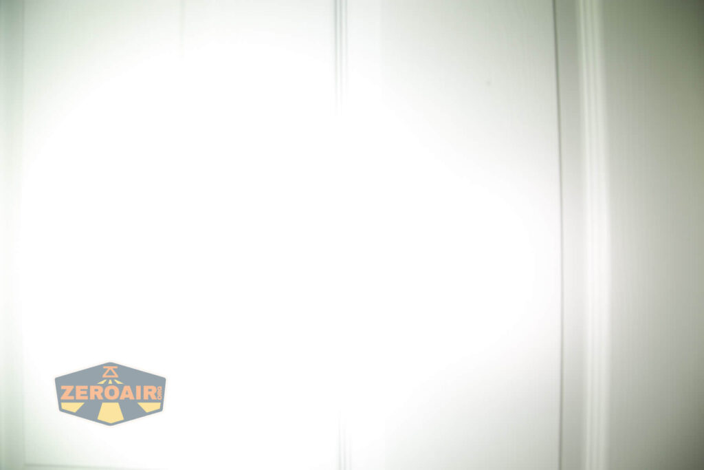 WWLZ Bamboo Small 18350 flashlight beamshots on door compared to nichia 219b white modes