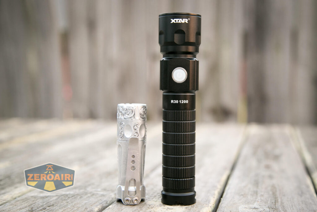 XTAR R30 1200 Flashlight beside torchlab boss 35