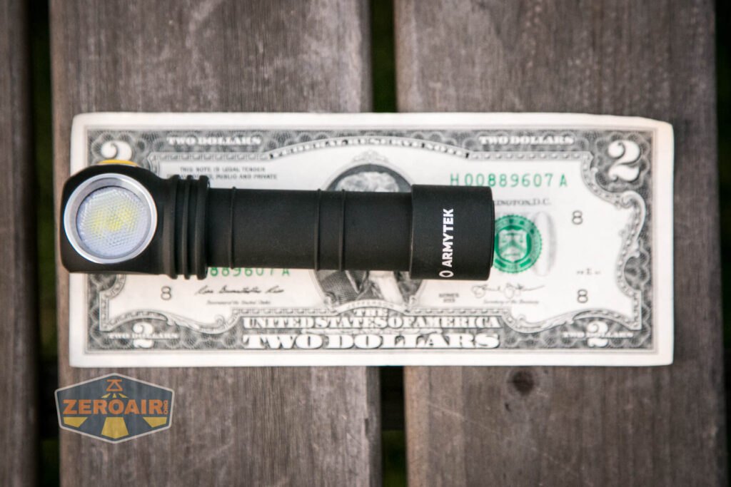 Armytek Wizard C2 WUV Headlamp on two-dollar bill