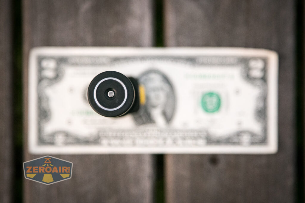 Armytek Wizard C2 WUV Headlamp on two-dollar bill