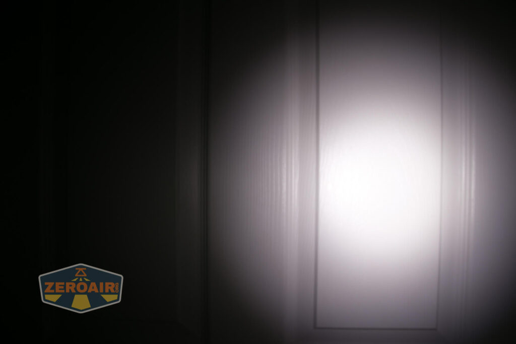 Armytek Wizard C2 WUV Headlamp beamshot on door compared to nichia 219b