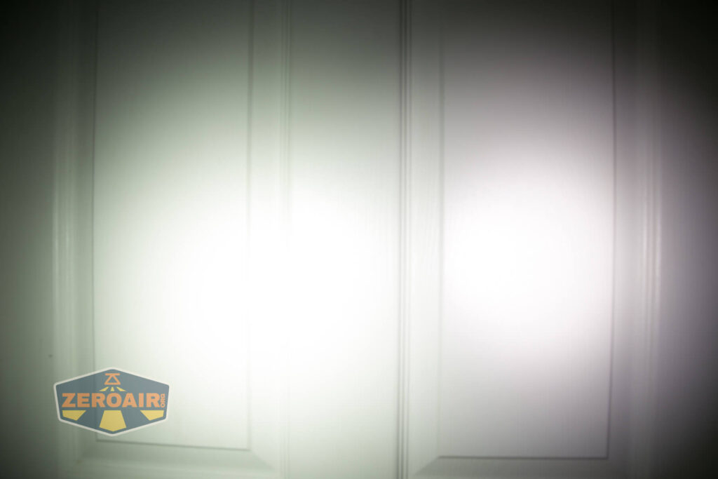 Armytek Wizard C2 WUV Headlamp beamshot on door compared to nichia 219b