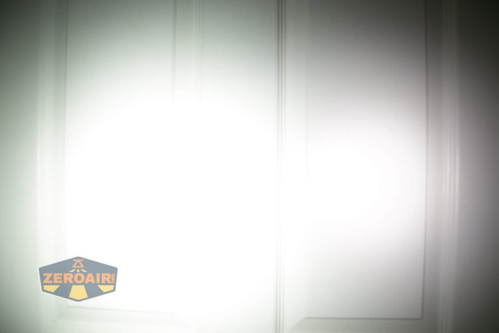 Armytek Wizard C2 WUV Headlamp beamshot on door compared to nichia 219b