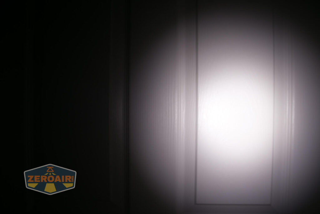 Armytek Wizard C2 WUV Headlamp beamshot on door compared to nichia 219b