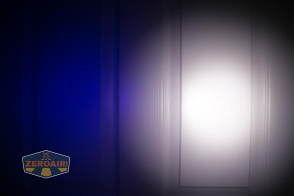 Armytek Wizard C2 WUV Headlamp beamshot on door compared to nichia 219b